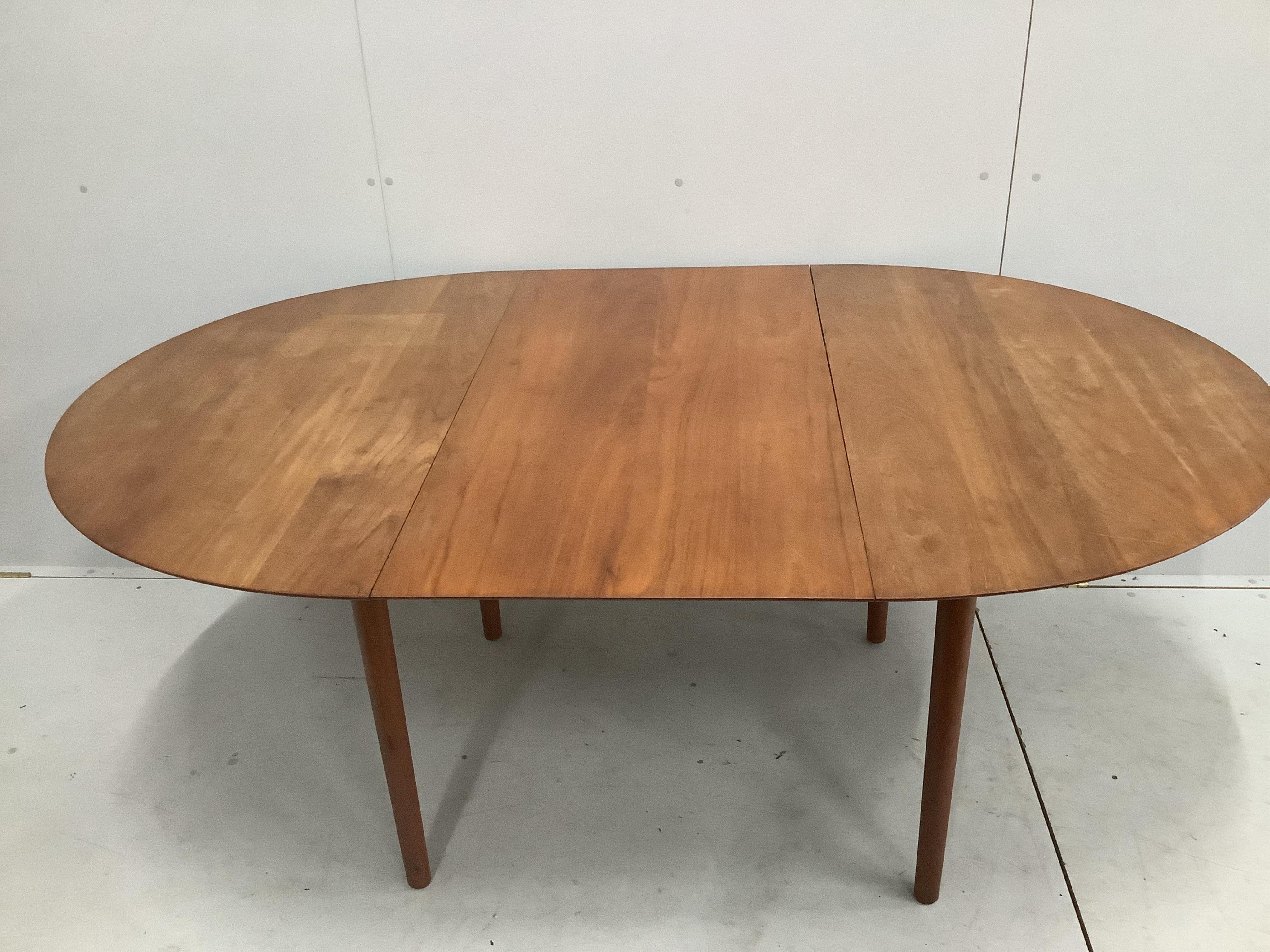 Niels Otto Moller. A Danish teak dining table, width approx. 180cm extended, depth 115cm, height 73cm together with six chairs. Condition - fair